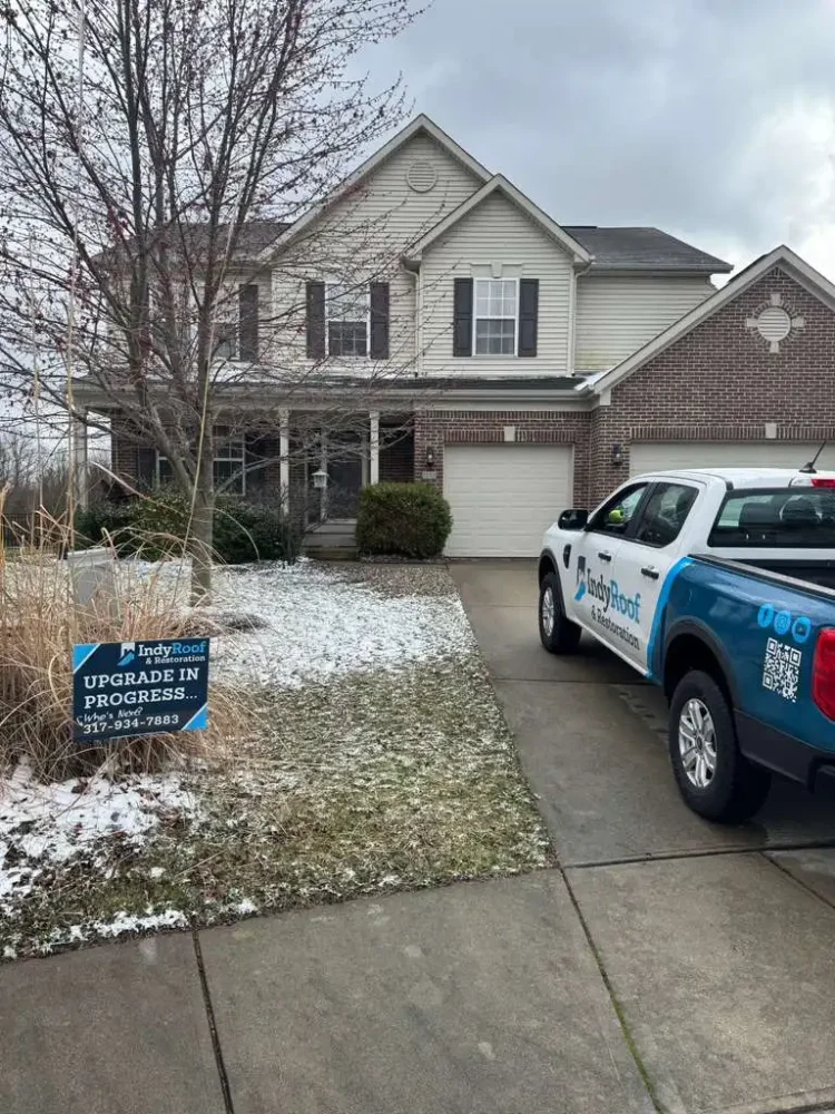 Roofer documenting storm damage during a professional roof inspection in Indiana
