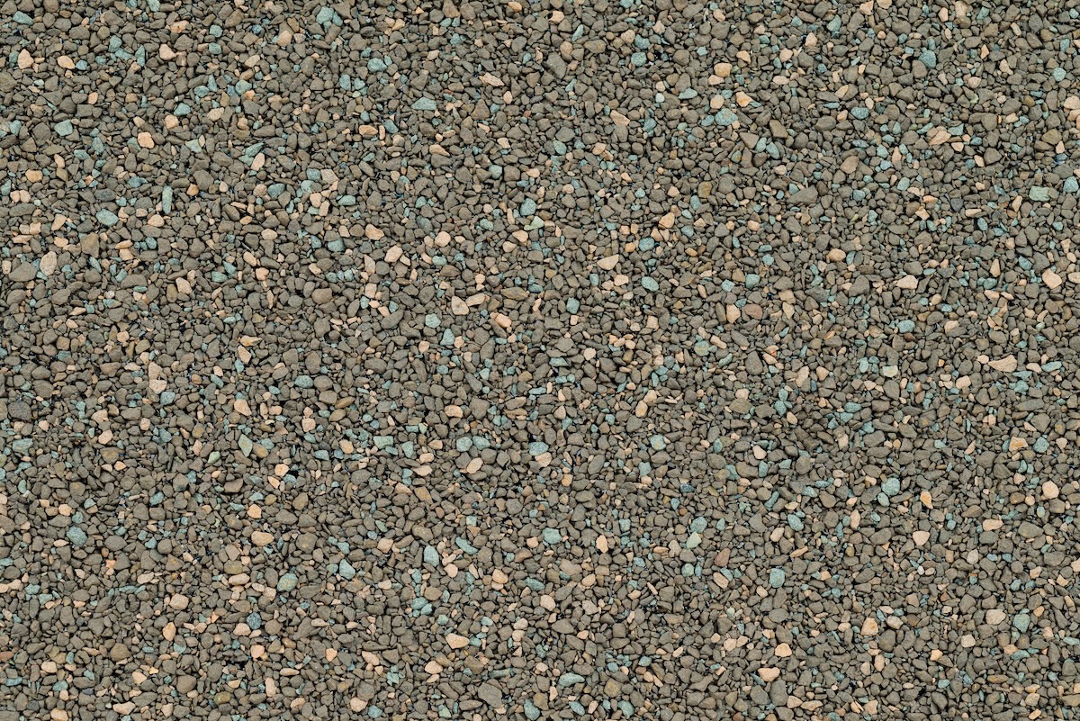 Close up detail shot of tar and gravel roof