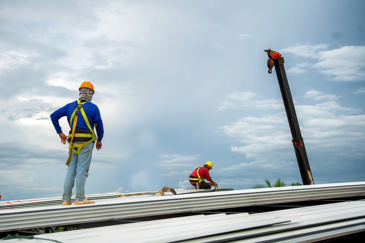 Commercial roof inspection two inspectors on roof